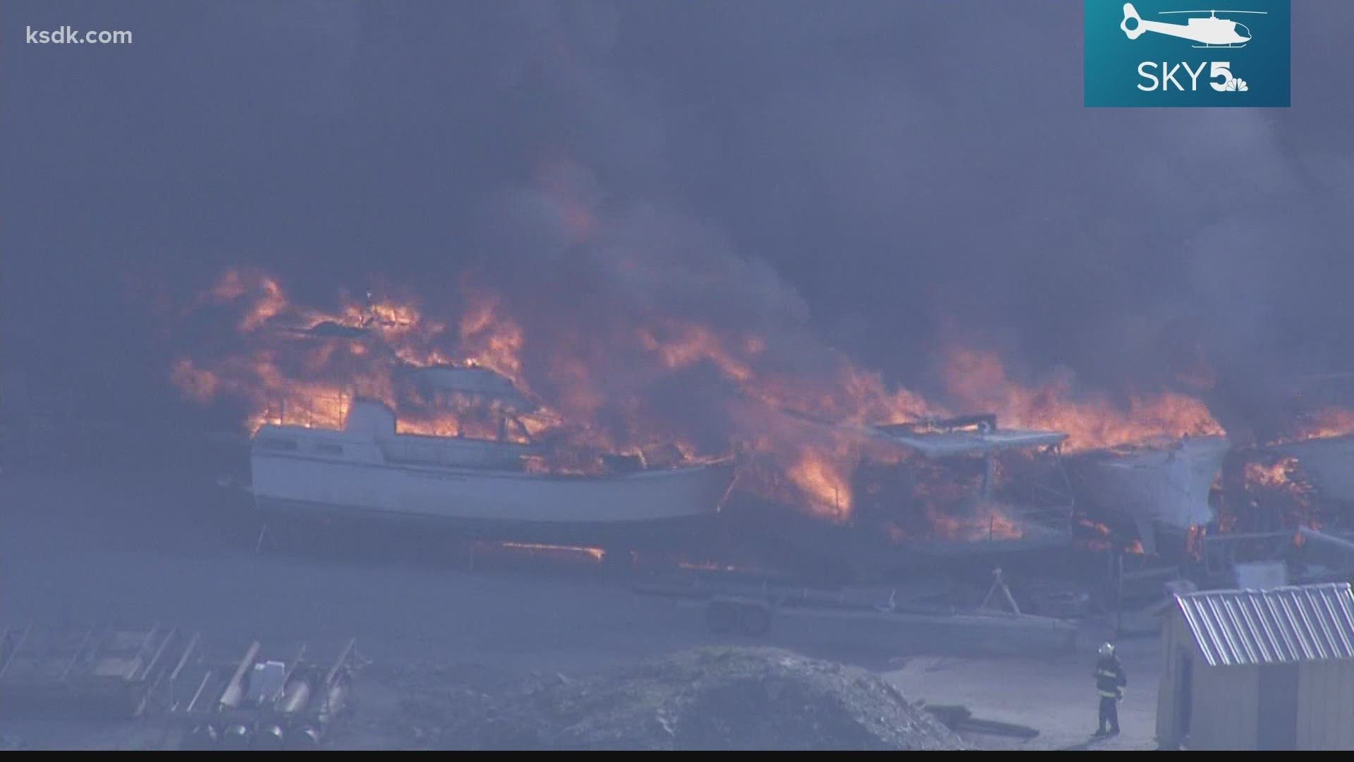 A spokesperson said a boat was in storage at Woodland Marina when it caught fire and “quickly escalated,” which caused the entire building to catch fire