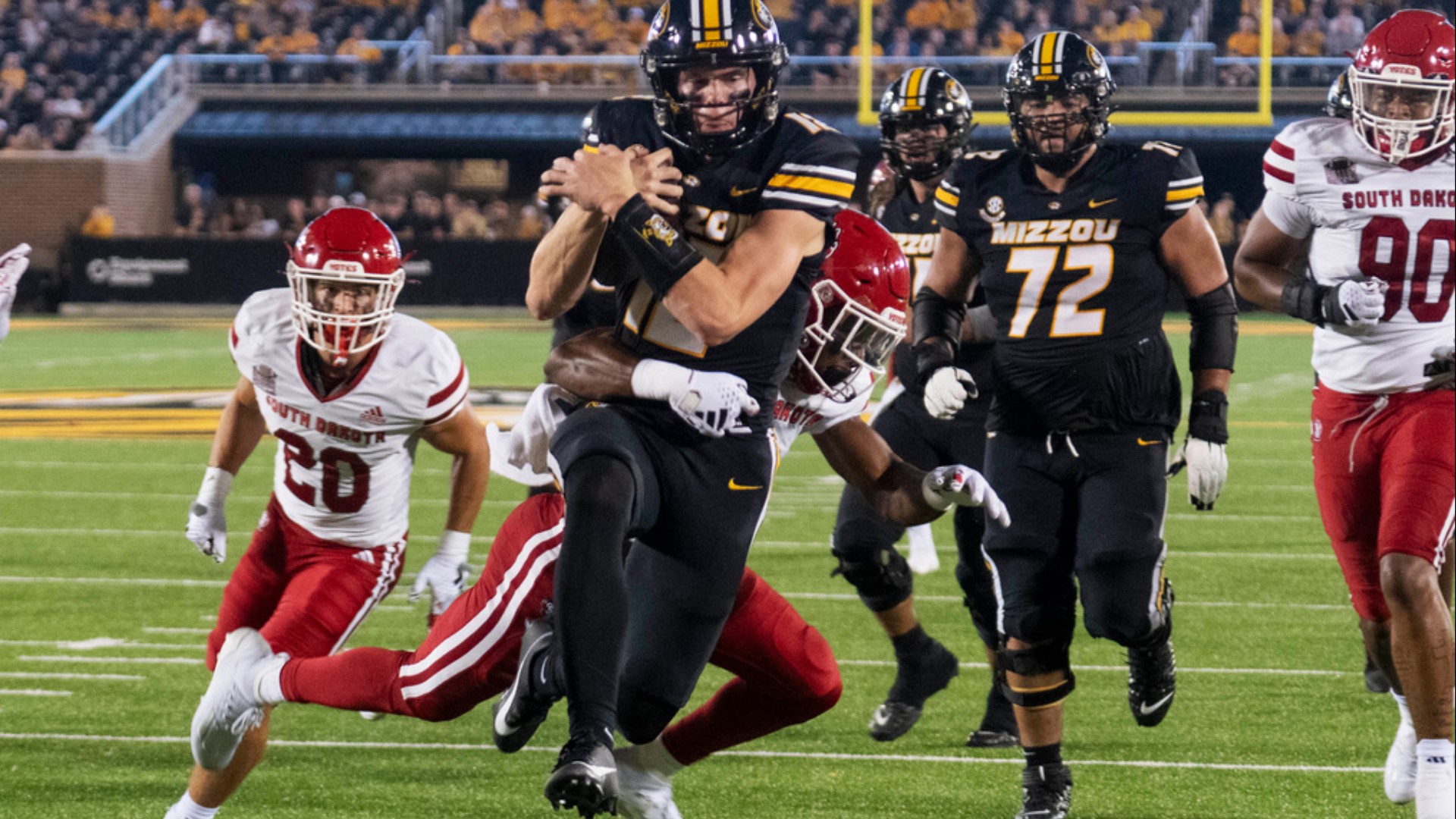 Brady Cook threw for 172 yards and a touchdown while running for another score in only one half of work. Missouri beat South Dakota 35-10.