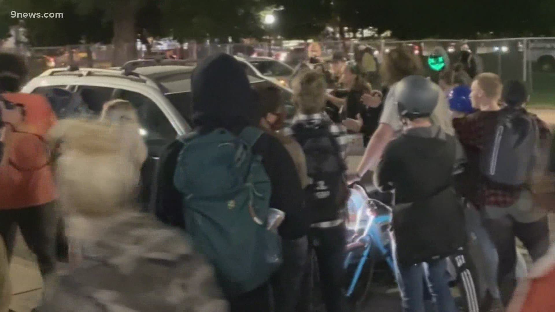 A driver who was seen driving through the protests has not been cited or arrested.