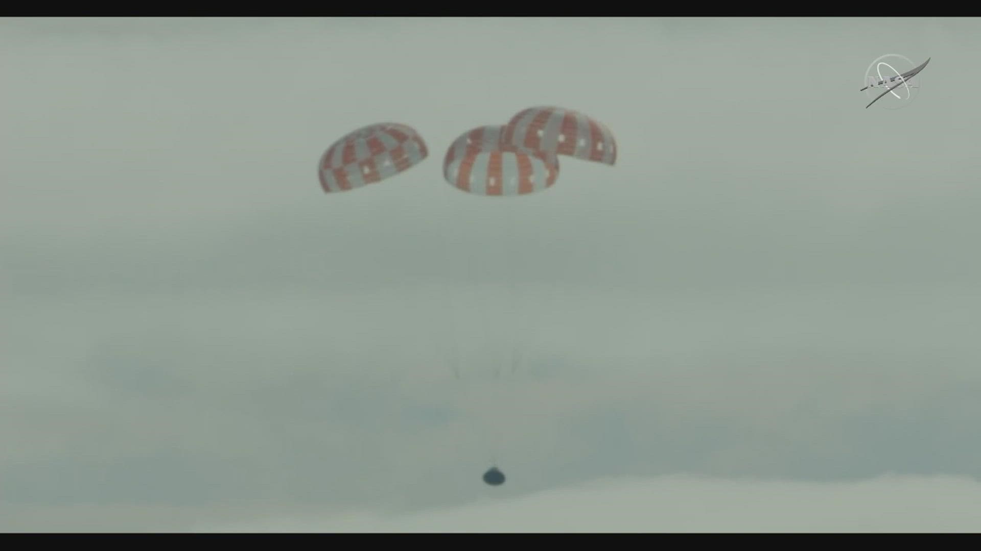 The capsule, crewed by test dummies as a rehearsal for a future moon flyby with astronauts, parachuted down off the coast of California.