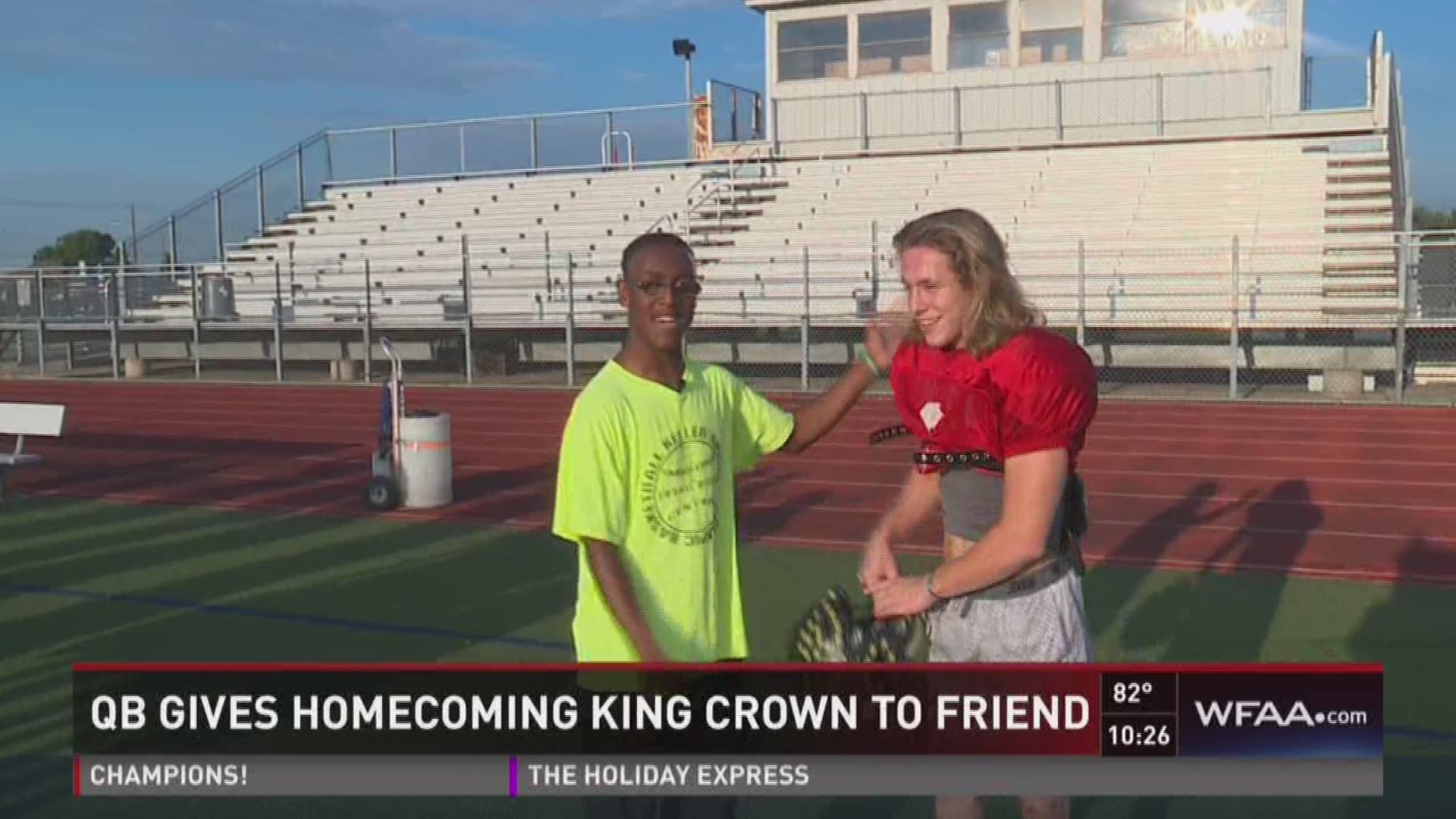 QB gives homecoming king crown to friend.