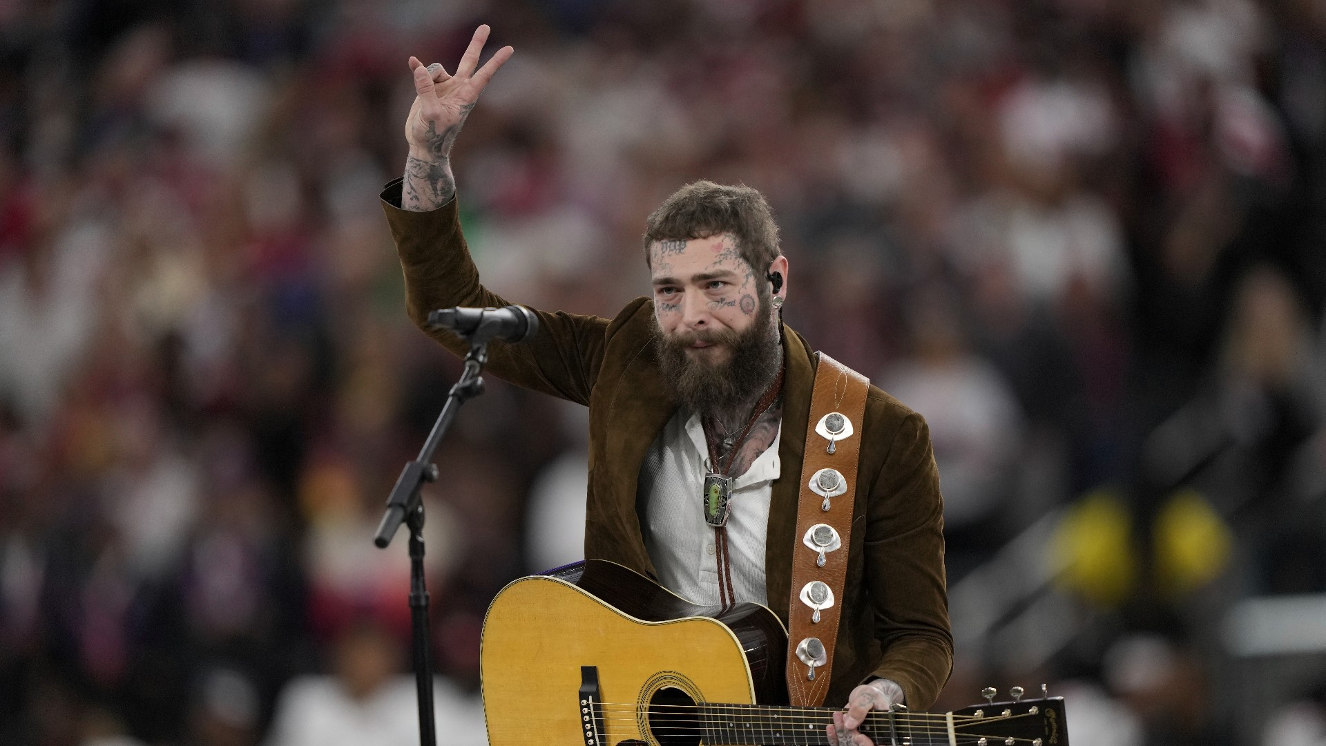 Post Malone wears upside down 'Dallas' True Brvnd hat