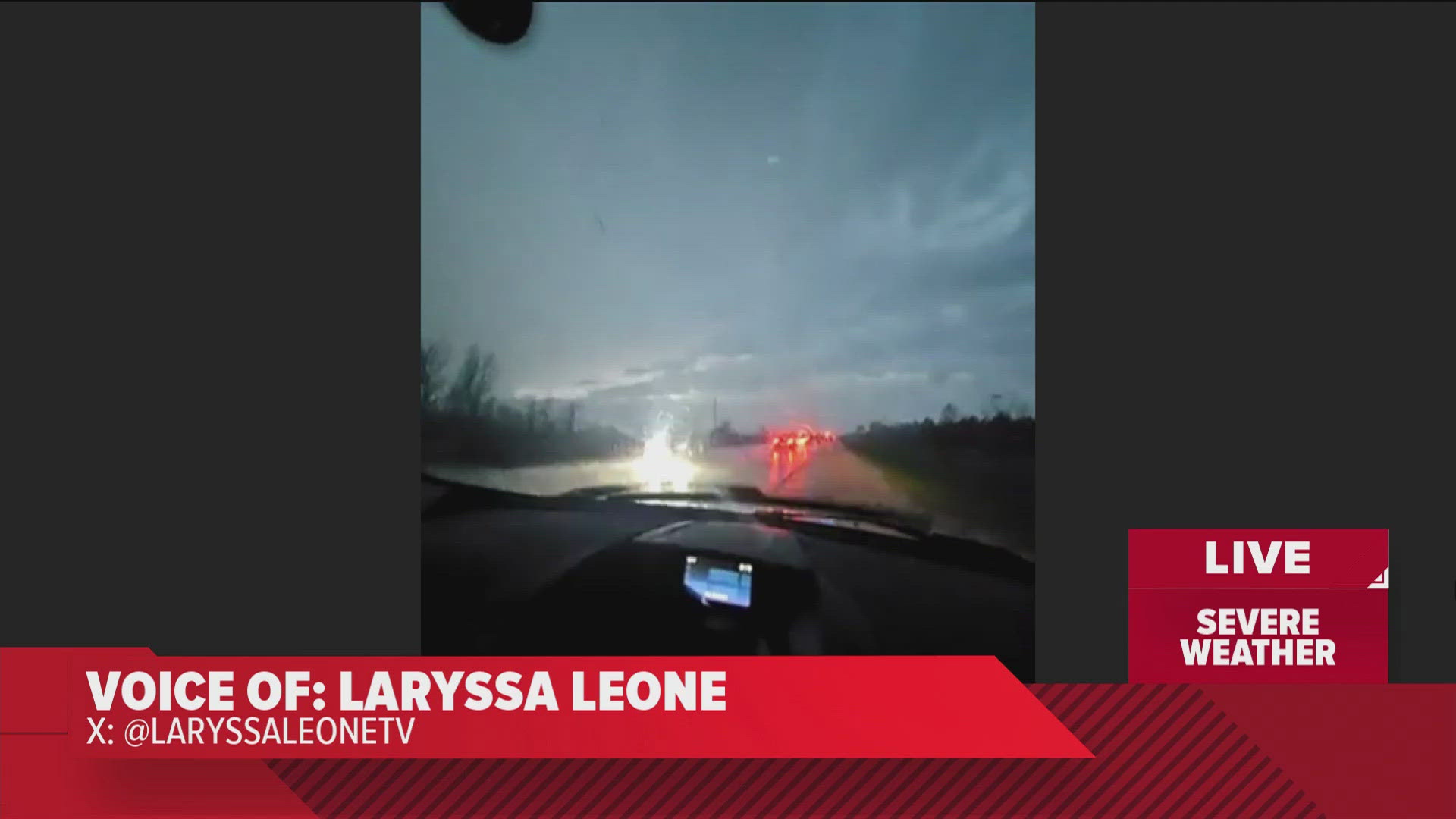 Police were present as cars attempted to maneuver around a power line during April 26's severe weather in Iowa.